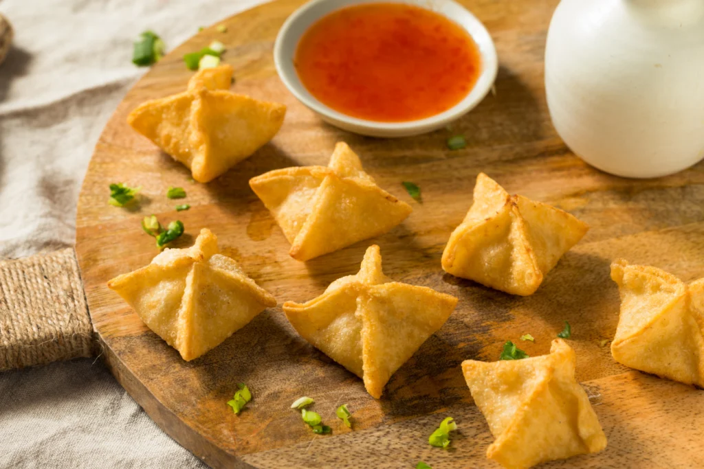 Master how to fold wonton wrappers, ensure sealing wontons without breaking, and learn cooking wontons without bursting with expert tips from Twin Dragon Wrappers. Get perfect boiled and crispy fried wontons every time!